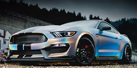 Wrapping completo di veicolo con effetto cangiante su coupé.
