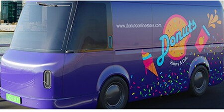 Purple delivery van wrapped in colourful 3M graphics for a doughnut bakery brand.
