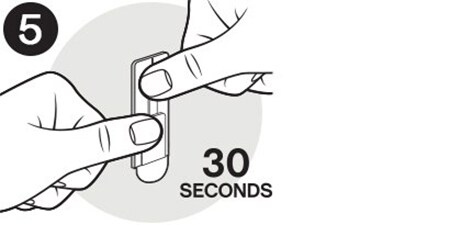 Icona che mostra come premere il gancio Command™ contro la parte per 30 secondi.
