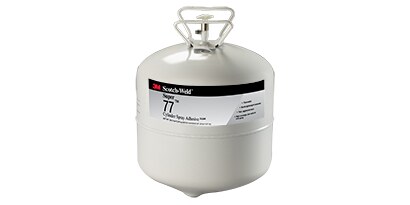 Gli adesivi a base acqua e a base solvente utilizzano un supporto liquido per l'applicazione dell'adesivo ai substrati. Immagine di un adesivo spray in un contenitore.
