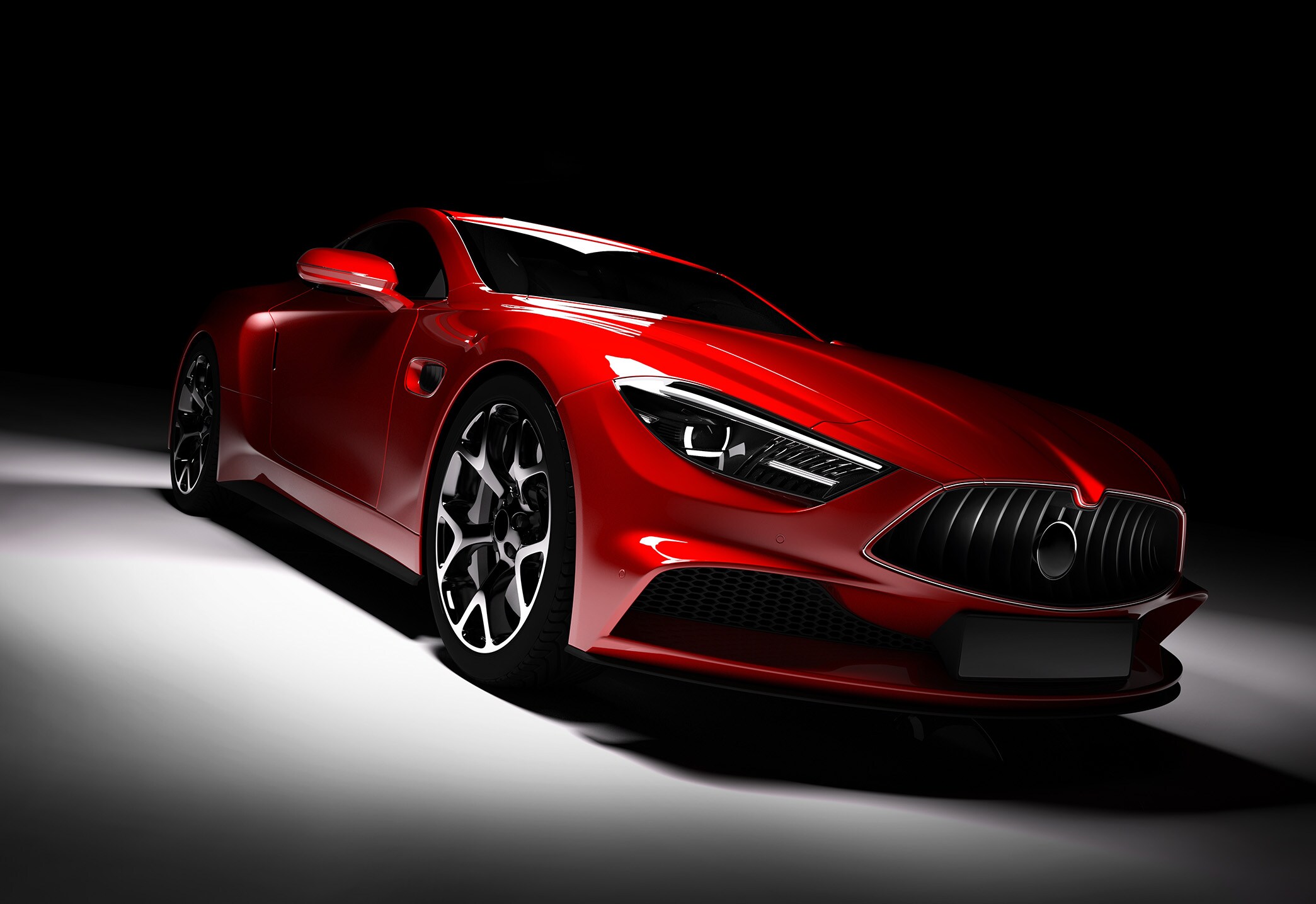 Immagine che mostra un'auto sportiva rossa su sfondo nero, grigio e bianco
