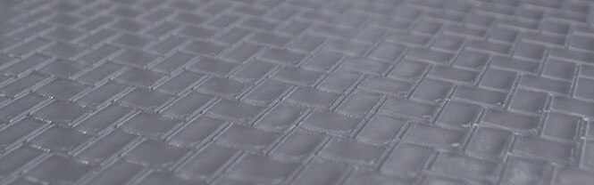 Primo piano del pad CMP 3M™ Trizact™ con design della scanalatura
